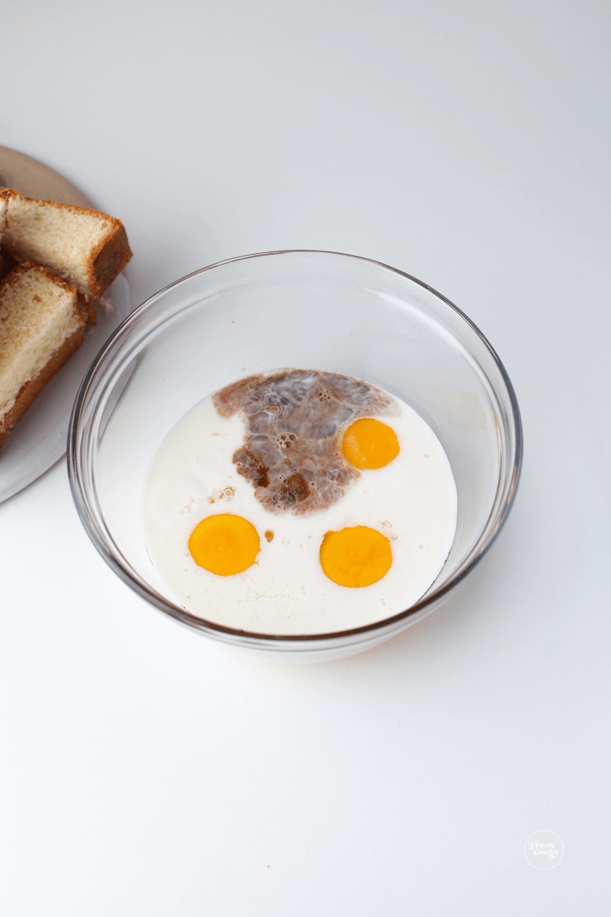 Mix together eggs, milk and vanilla.