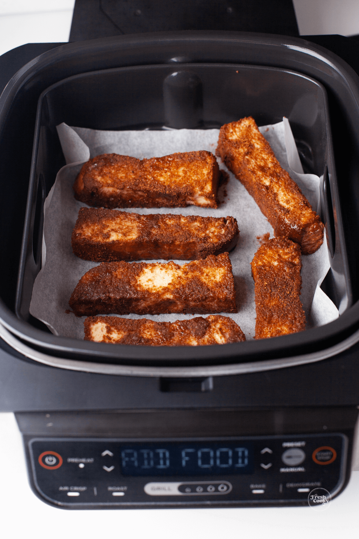 French toast sticks inside Ninja foodi air fryer.