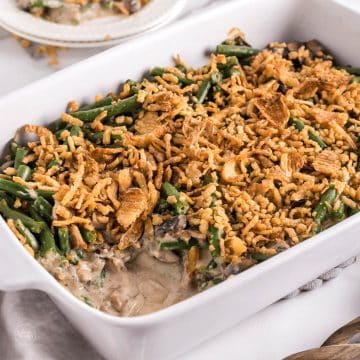 Green bean casserole in dish, with serving removed.