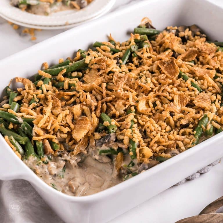 Green bean casserole in dish, with serving removed.