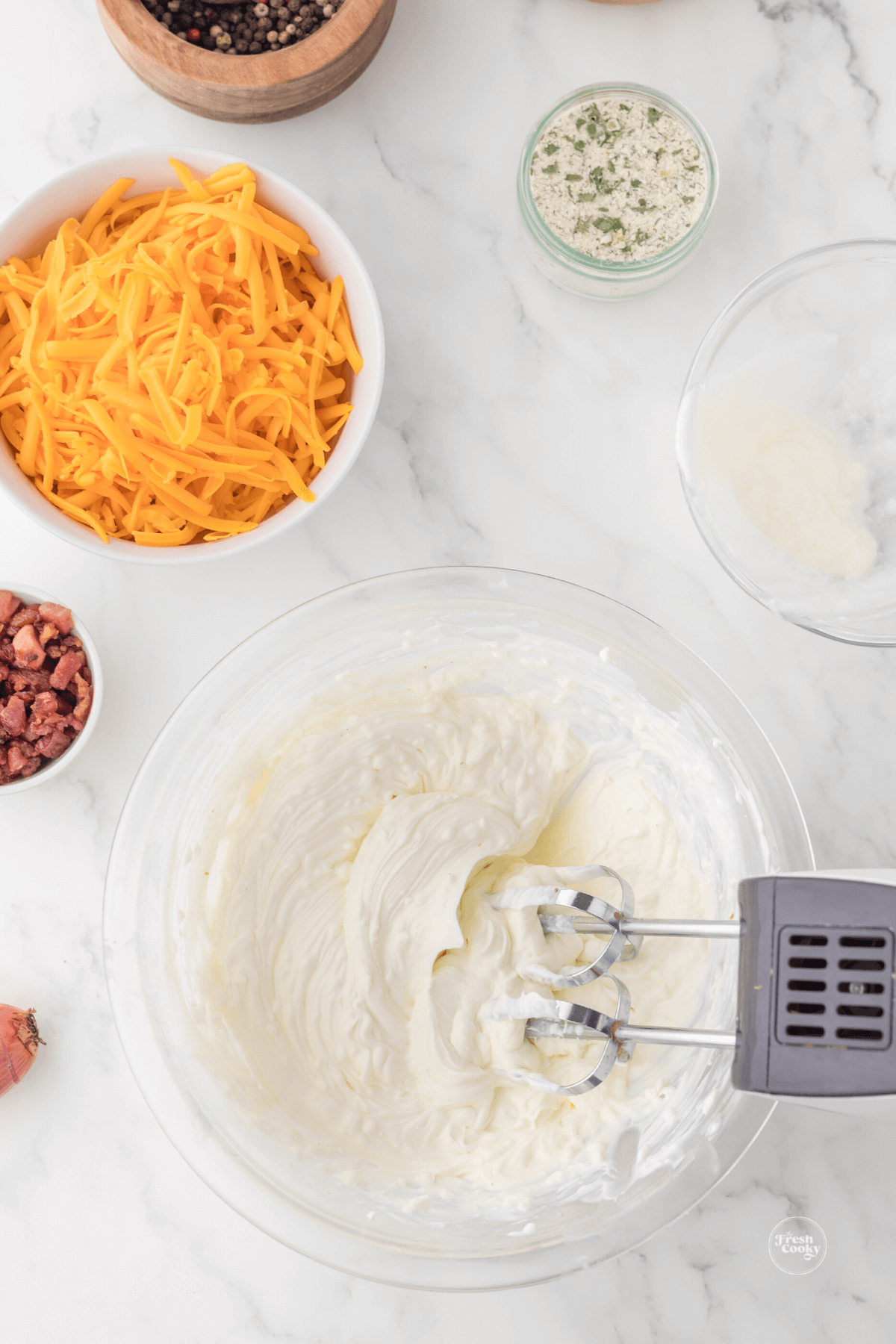 Whipping sour cream and cream cheese.