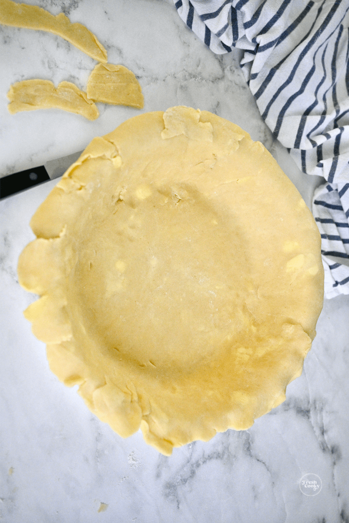Trimmed pie dough.
