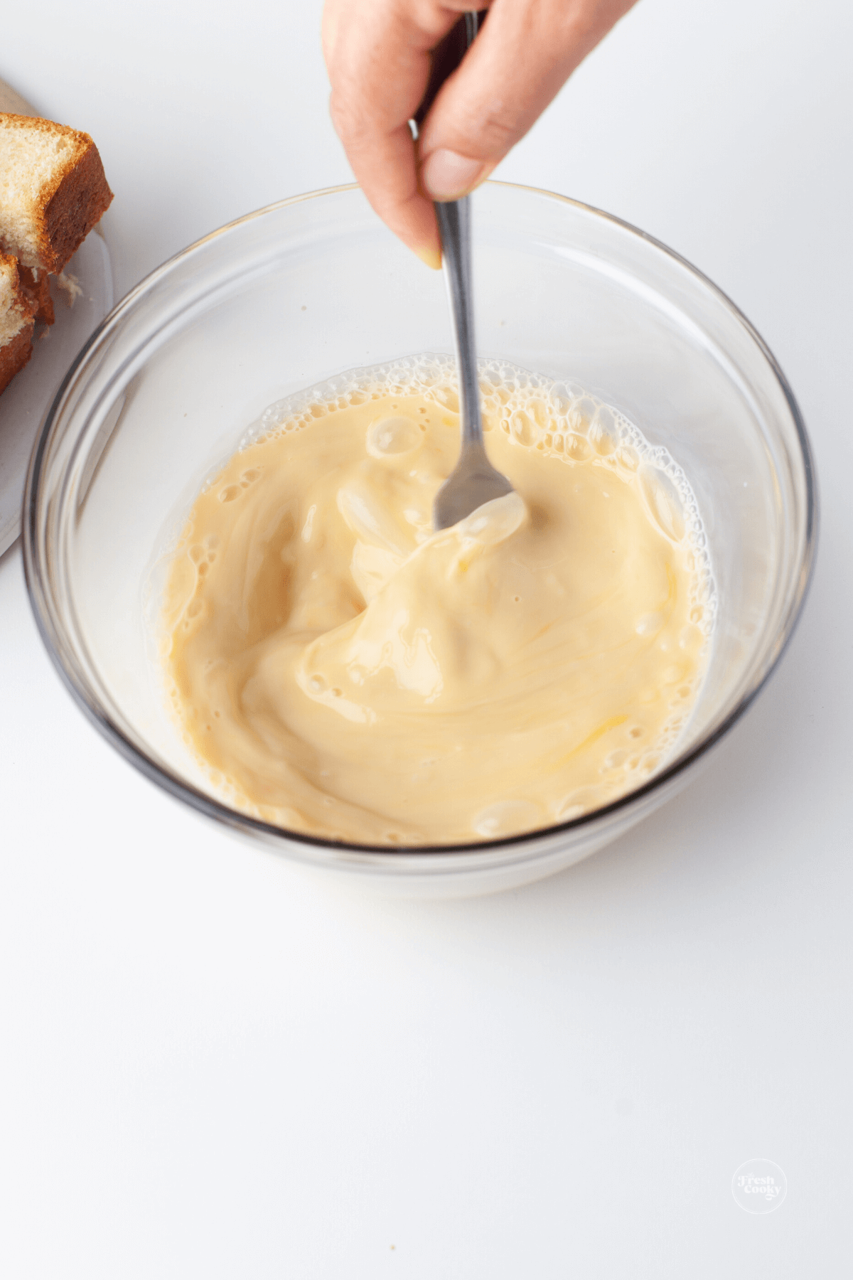 Whisking bowl of egg mixture for french toast sticks. 