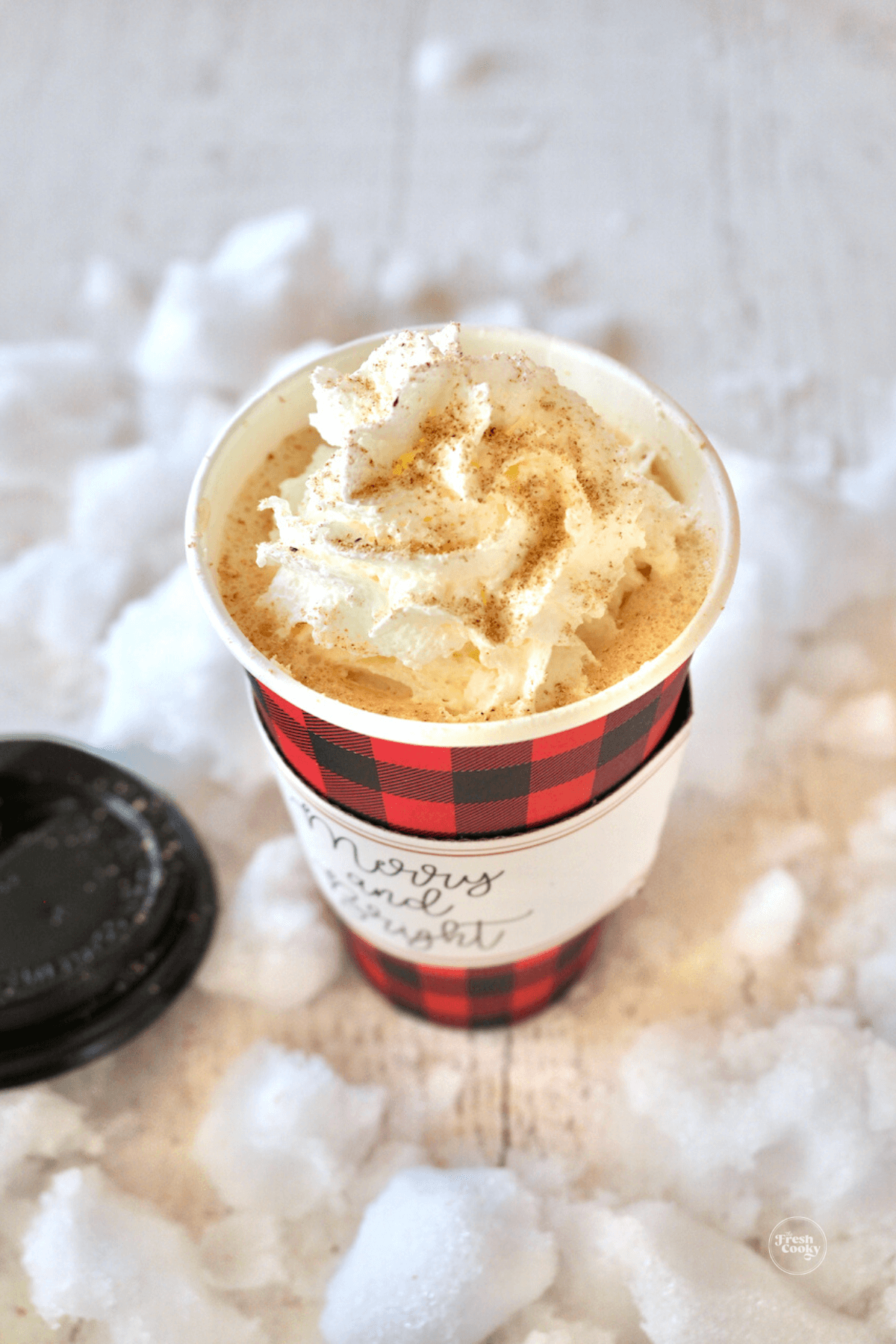 Starbucks eggnog latte recipe in festive Christmas to-go cup.