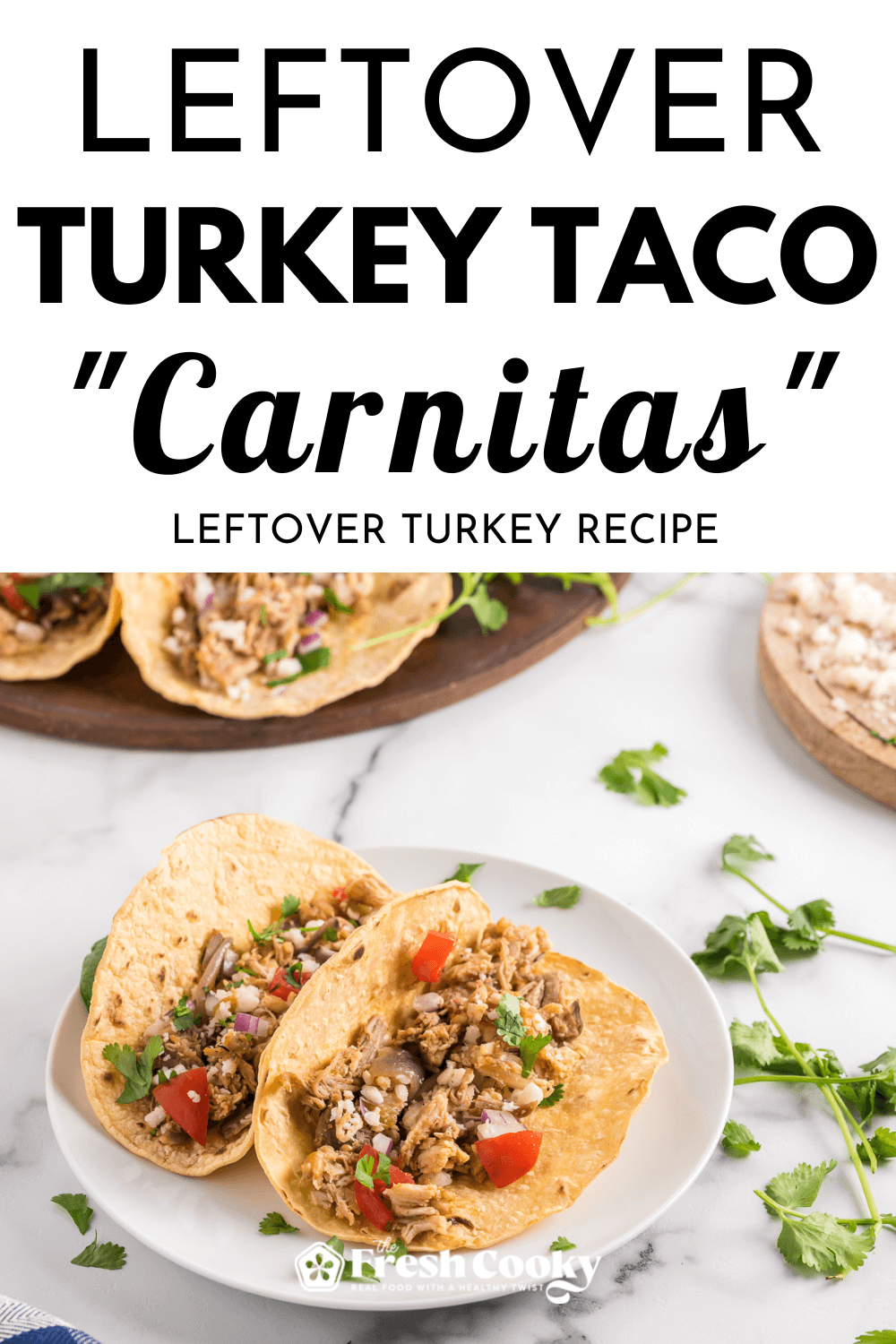 Leftover turkey taco carnitas on a plate with toppings, for pinning.