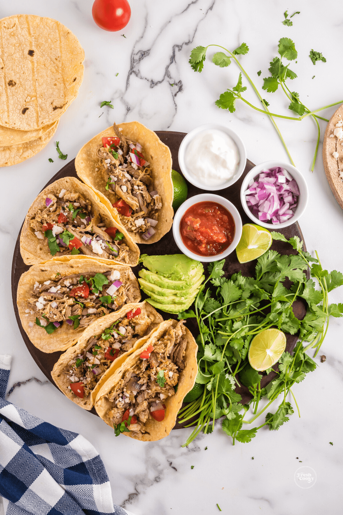 Leftover turkey tacos on platter with toppings.