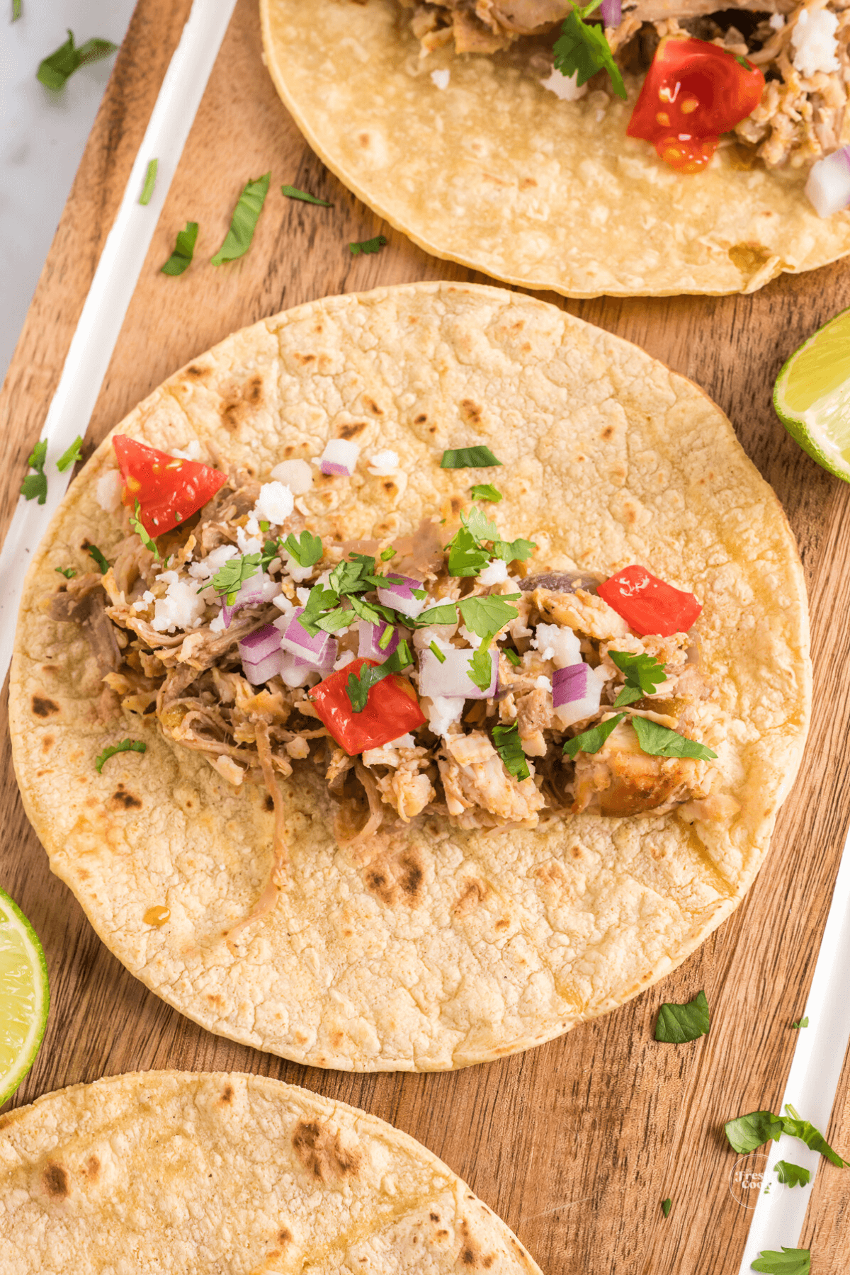 Building turkey tacos with toppings.