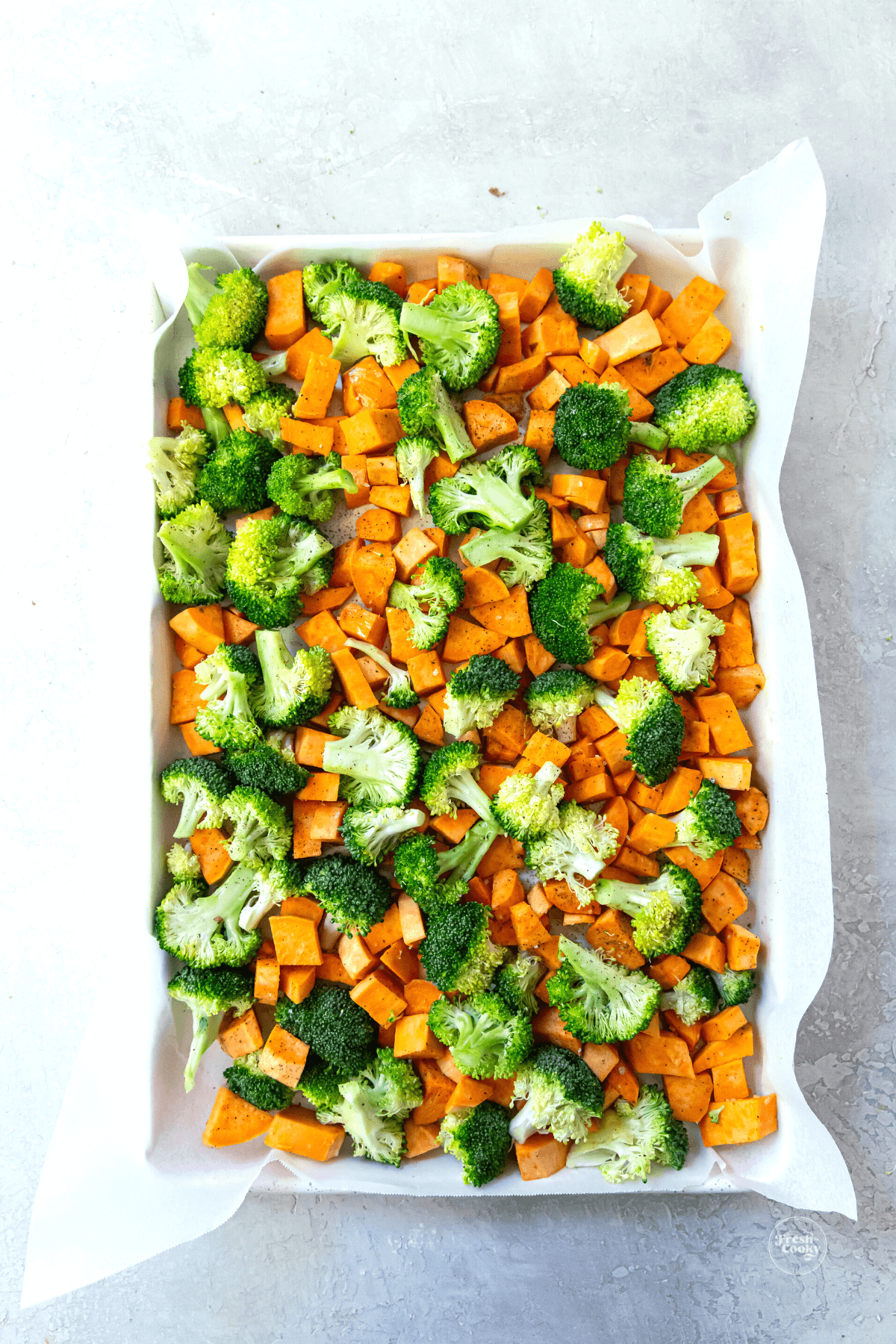 Vegetables on sheet pan with parchment. 