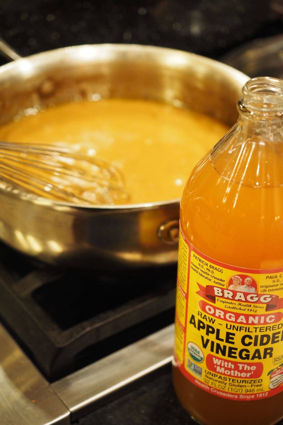 Adding vinegar to the turkey stock. 