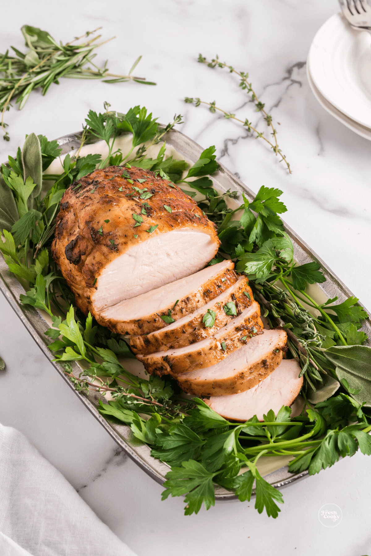 Sliced turkey breast on platter.