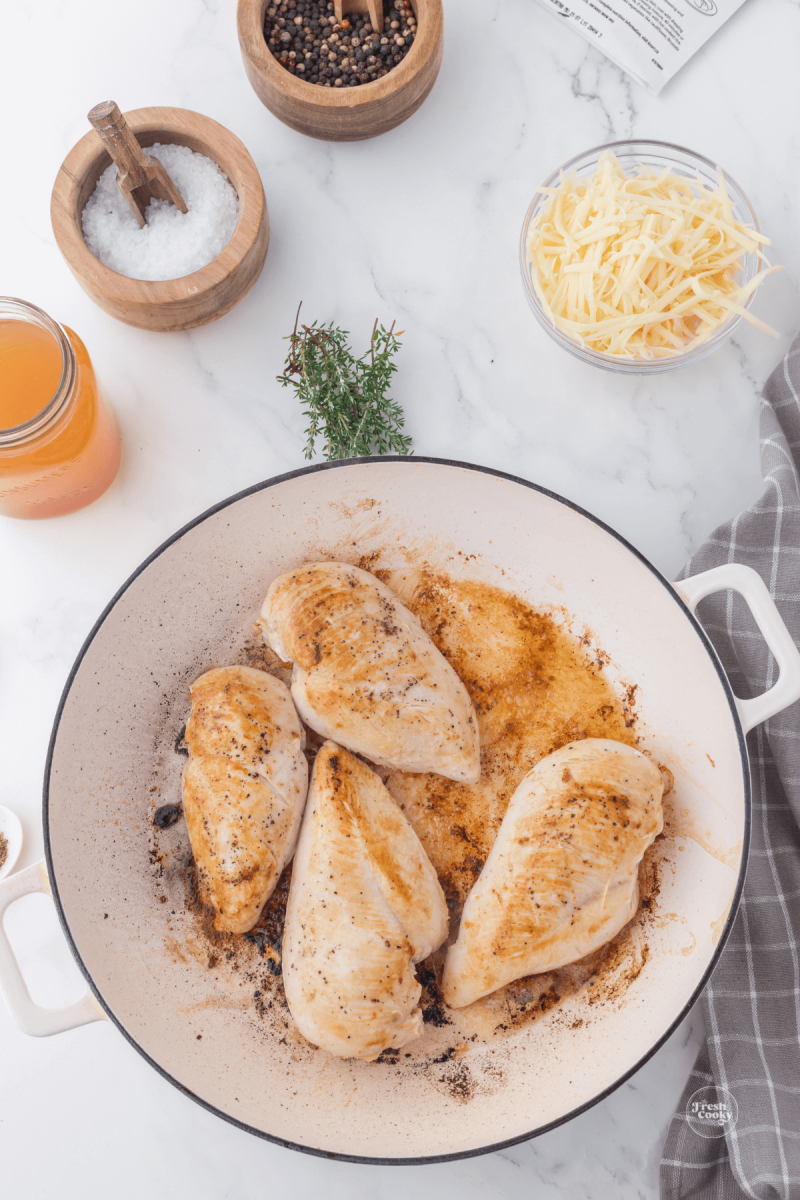 Browning chicken in skillet.