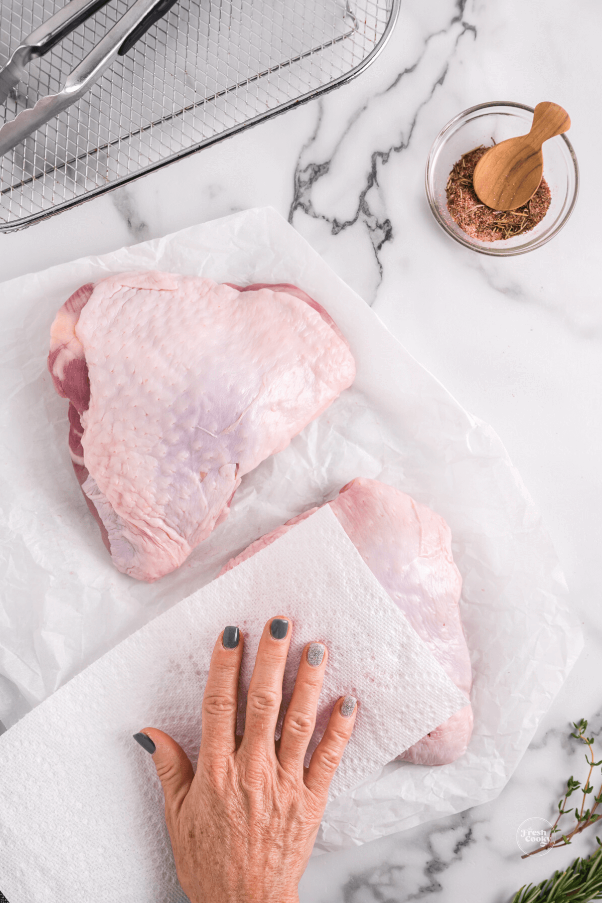 Pat dry turkey thighs with paper towels.