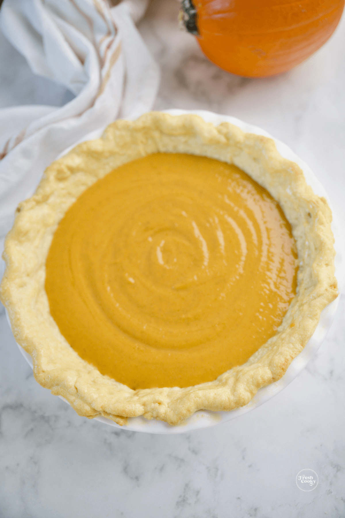 Pumpkin custard mixture poured into pre-baked pie shell. 
