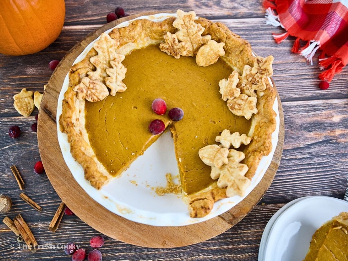 Hero shot Pumpkin Custard Pie with slice removed.