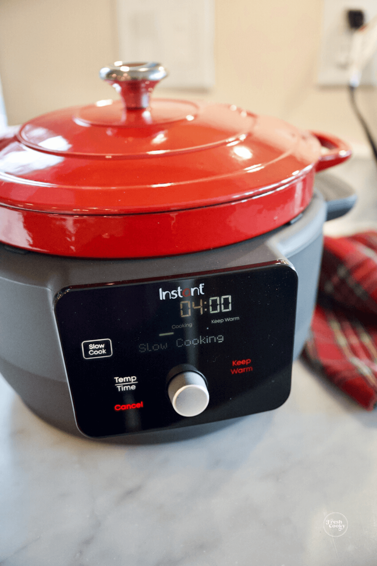Instant Electric Dutch Oven on slow cook with 3 ingredient cranberry meatballs. 