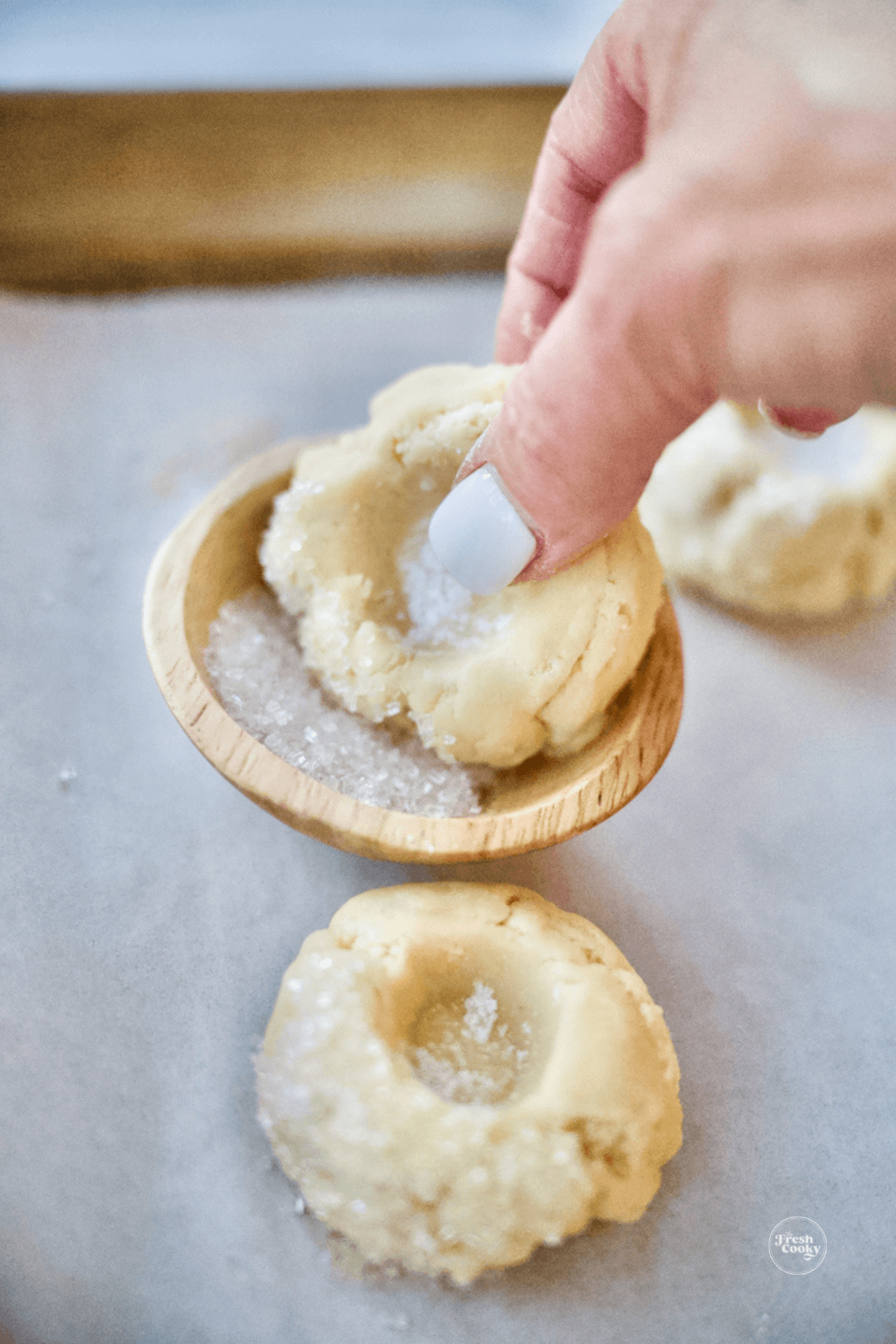 Optional rolling of edge of cookie dough into sparkling sugar.