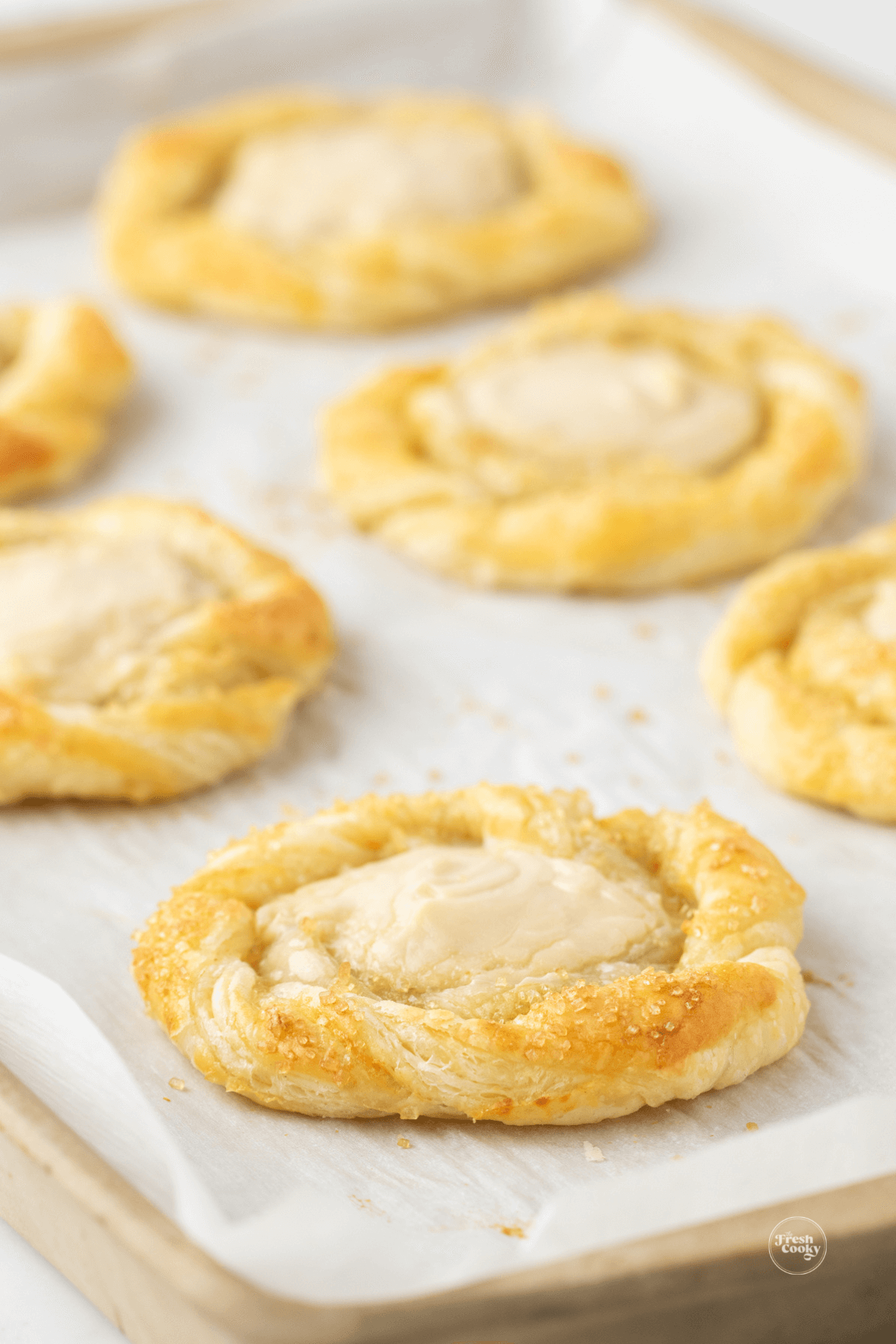 Beautiful cream cheese danishes on baking sheet. 