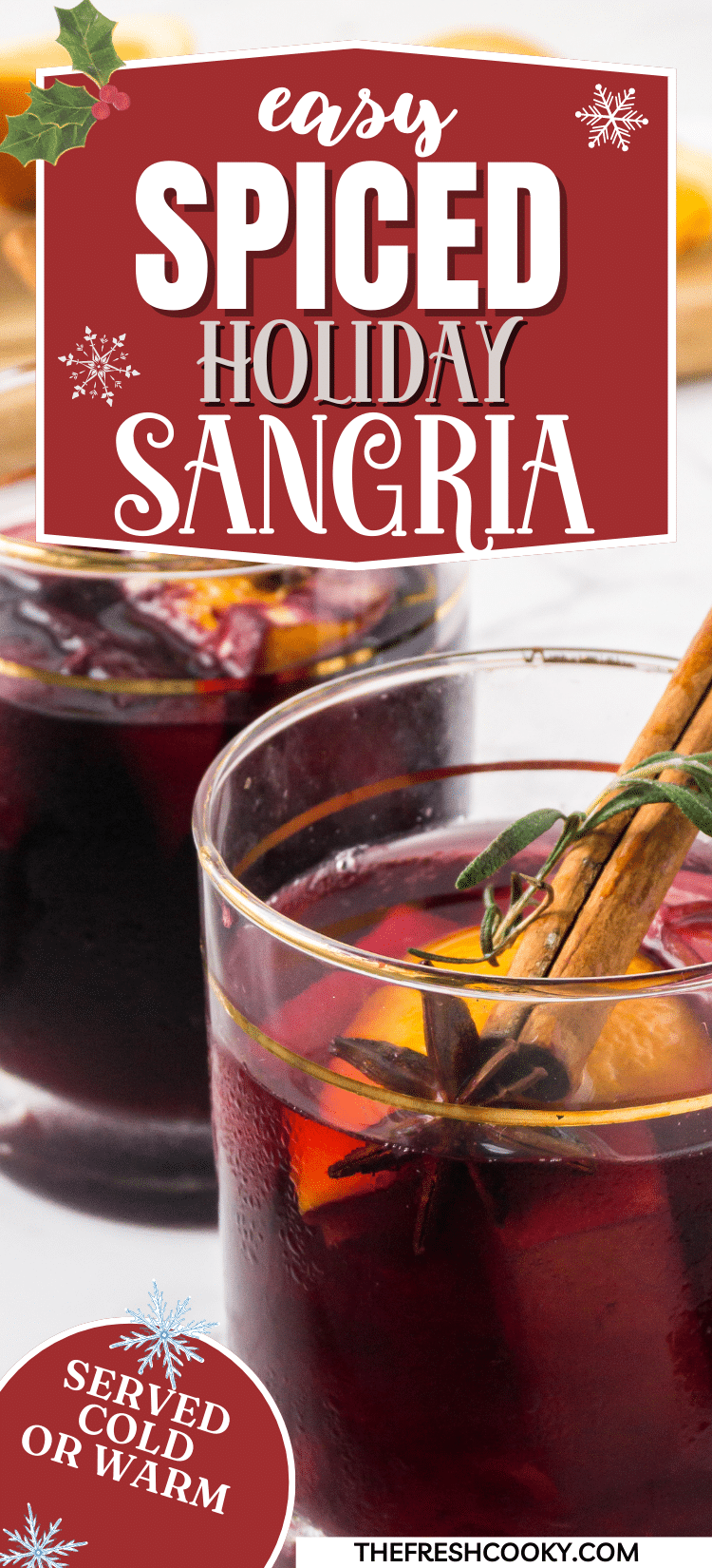 Spiced holiday sangria in pretty glass garnished with cinnamon stick, to pin.