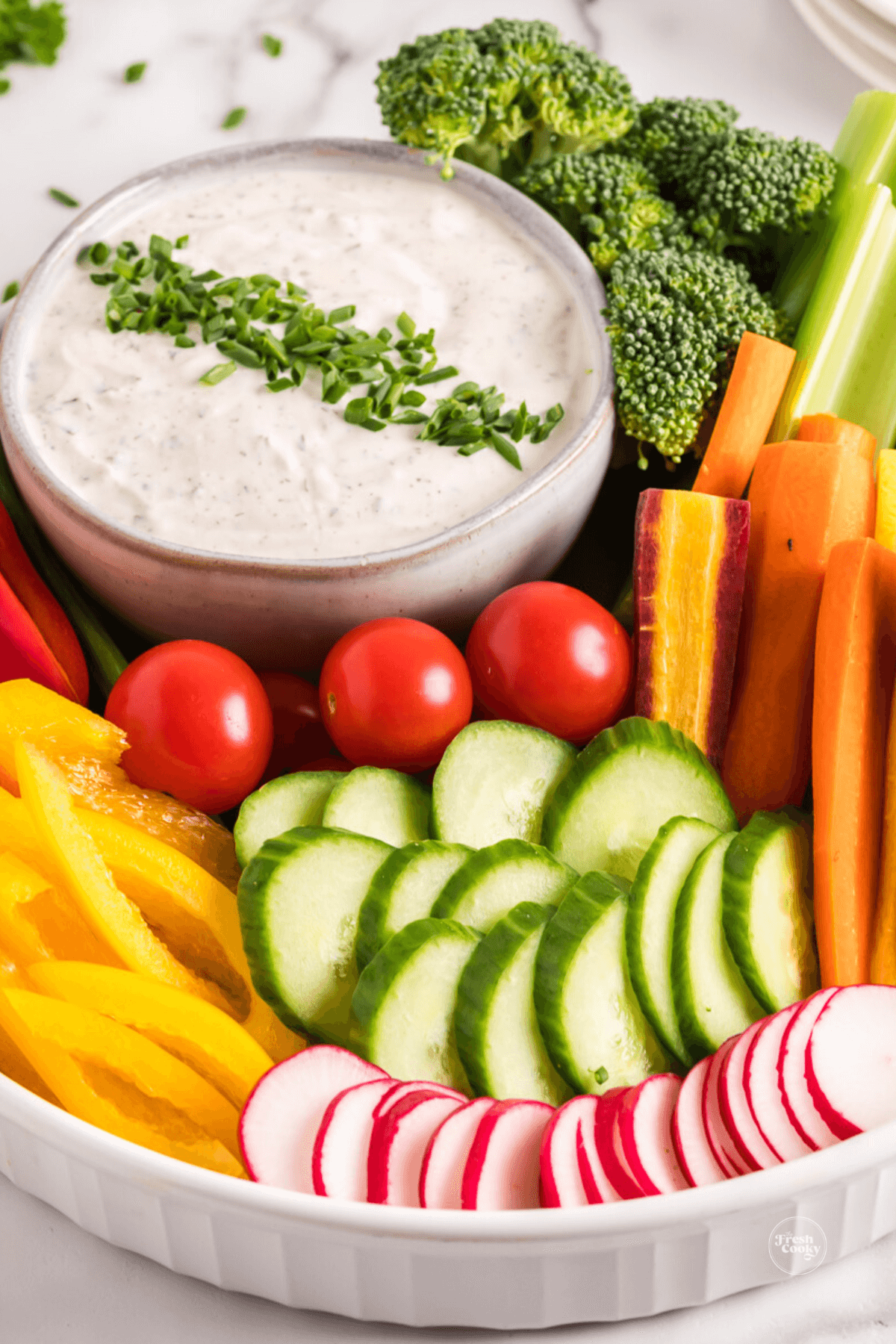 Crudite dip recipe in a beautiful serving bowl full of fresh, crisp veggies.