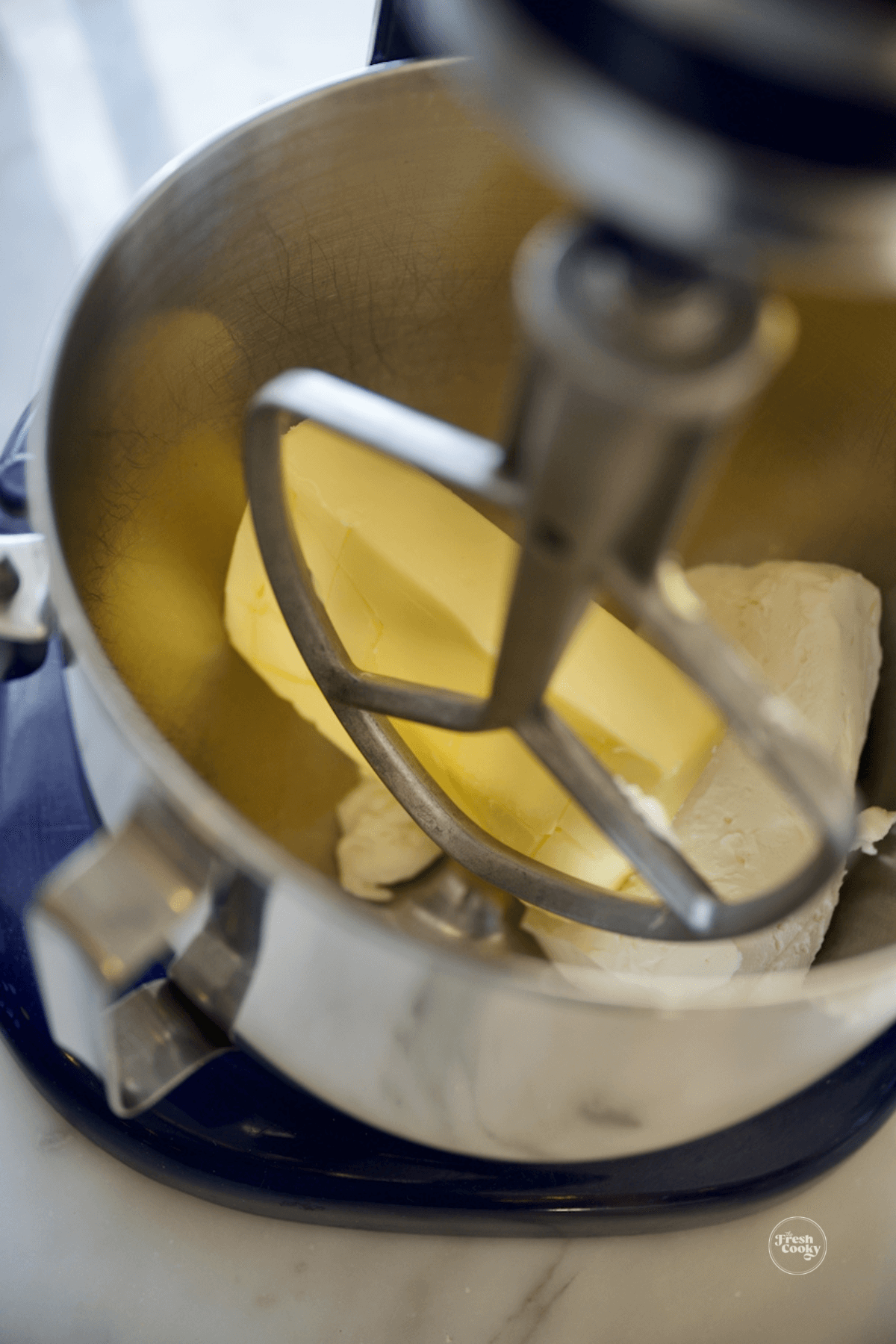 Add softened butter and cream cheese to mixer.