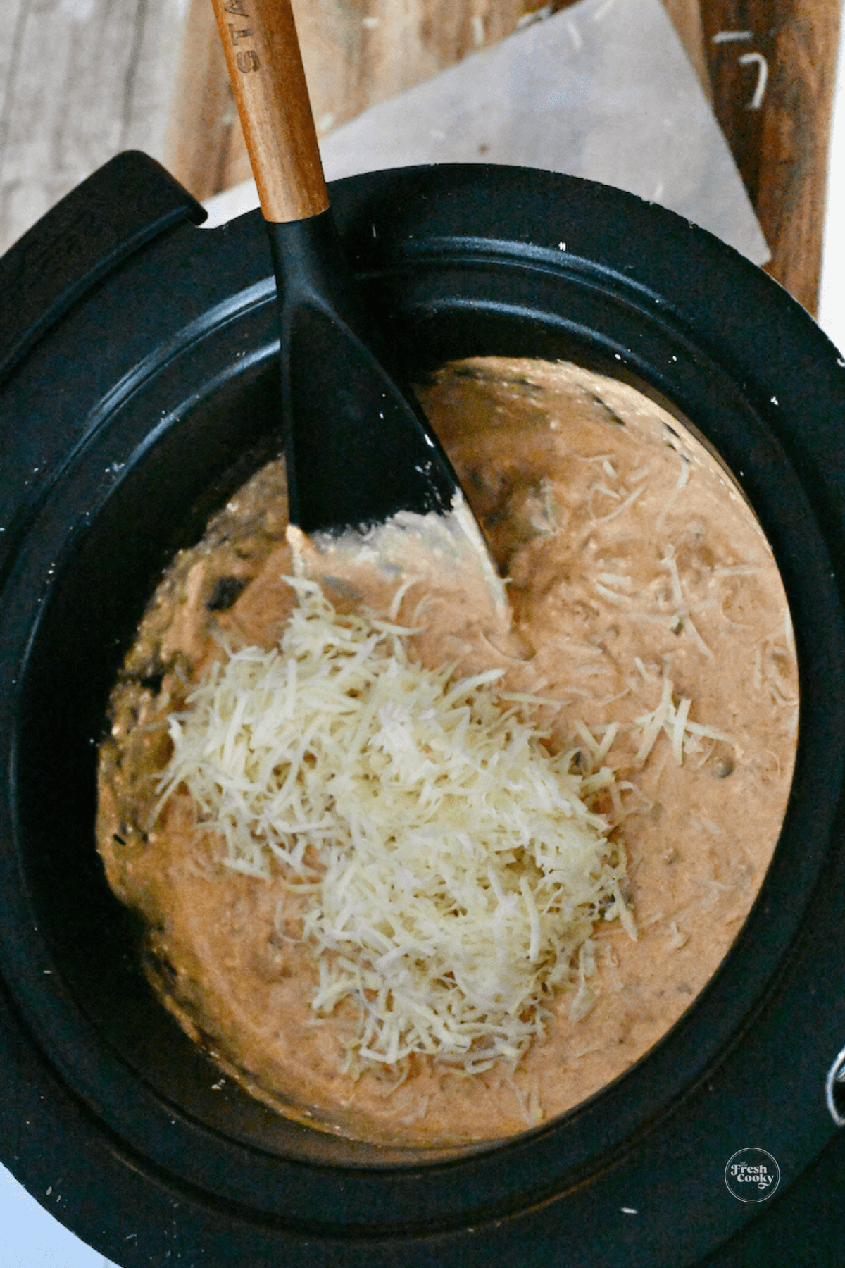 Stir in most of cheese into chili cheese mixture.