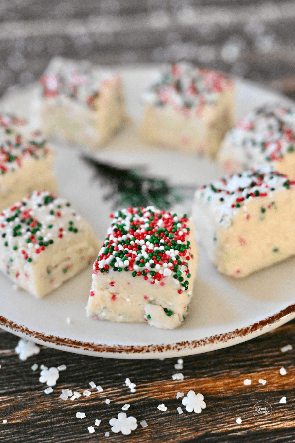 Plate filled with bites of Christmas Cookie Fudge.