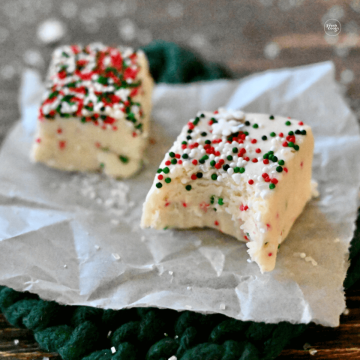 Christmas sugar cookie fudge with bite taken out of one piece.