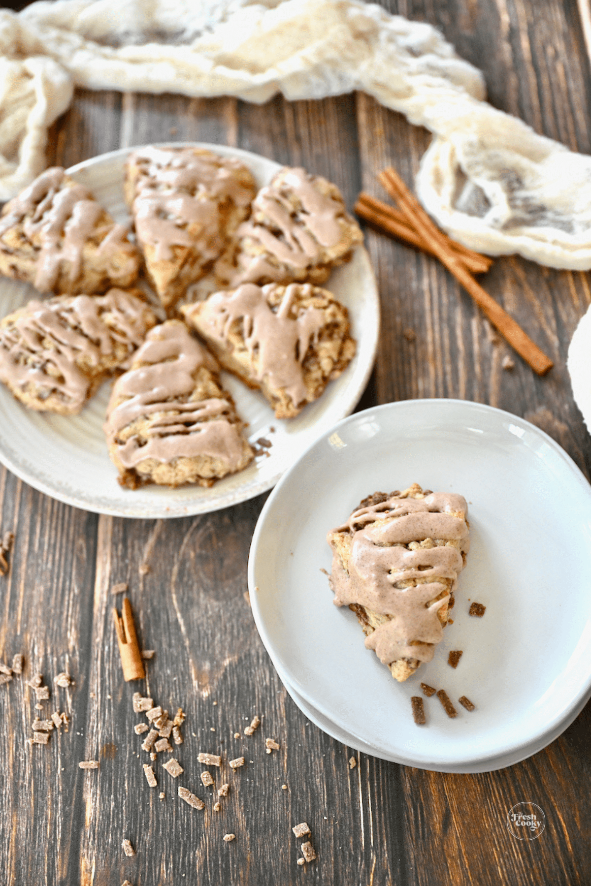 Cinnamon Chip Panera Scones on a plate and one on a smaller plate.