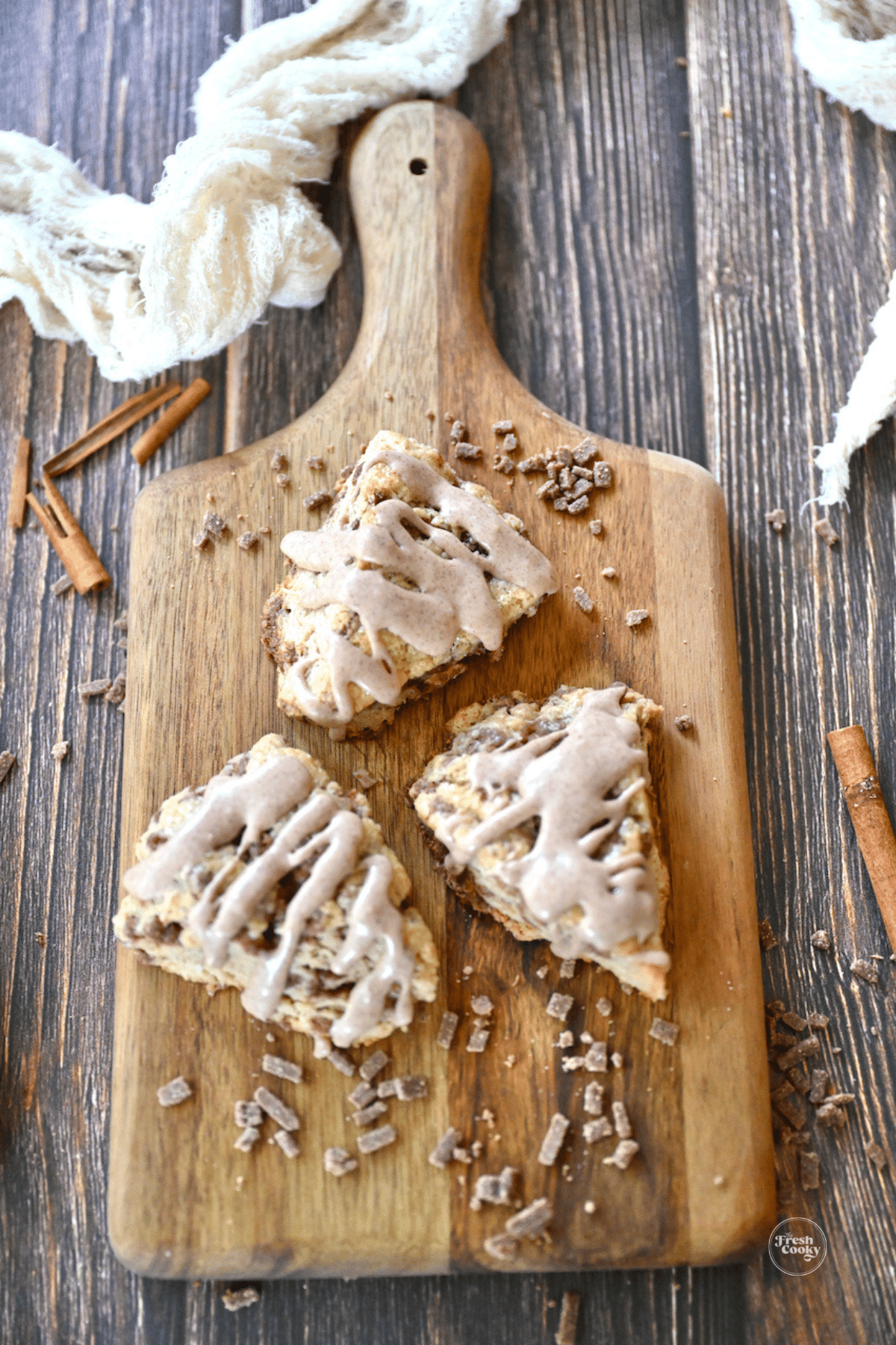 Cinnamon Chip Scones on a small cutting board.