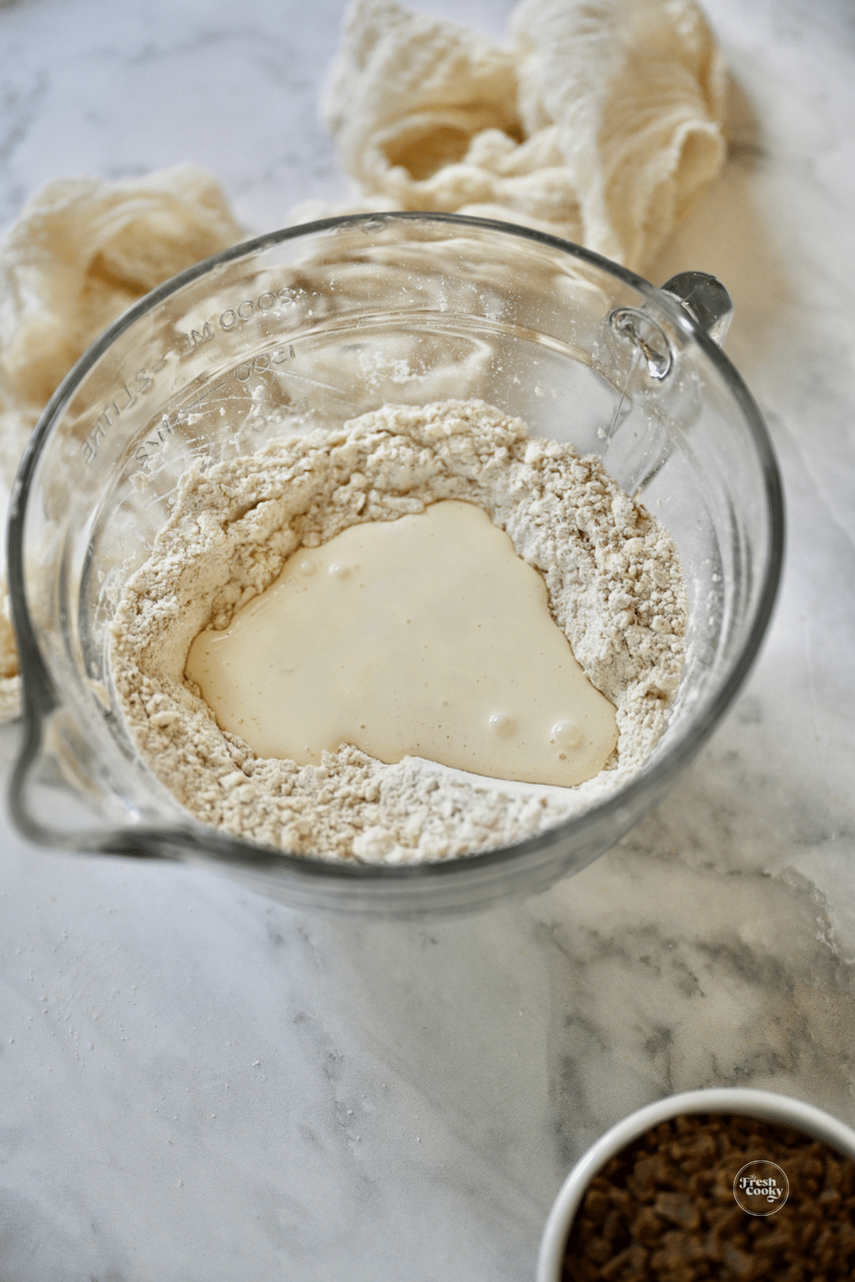 Liquid ingredients in well in dry ingredients for scones.