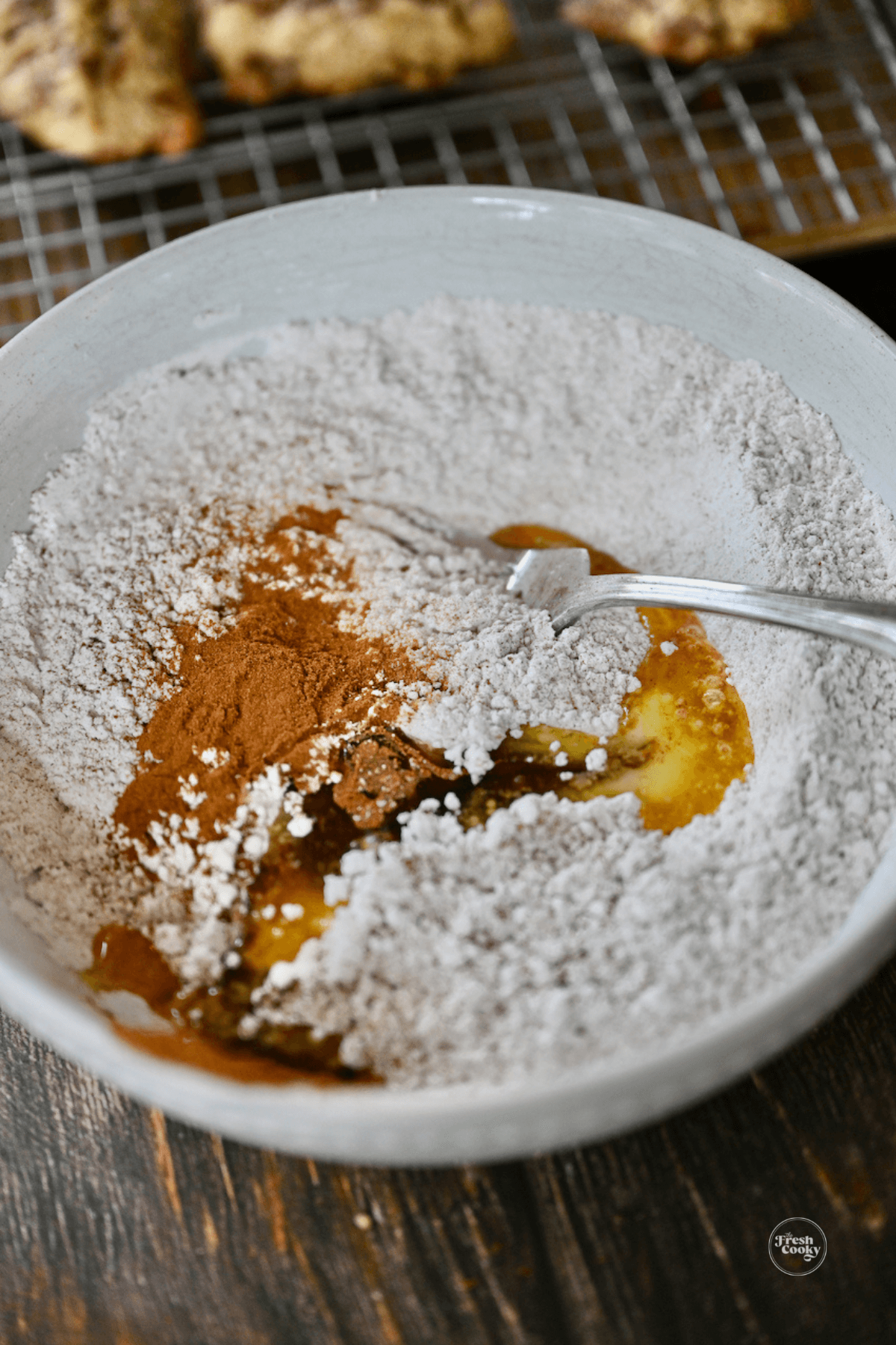Mixing glaze ingredients in bowl.