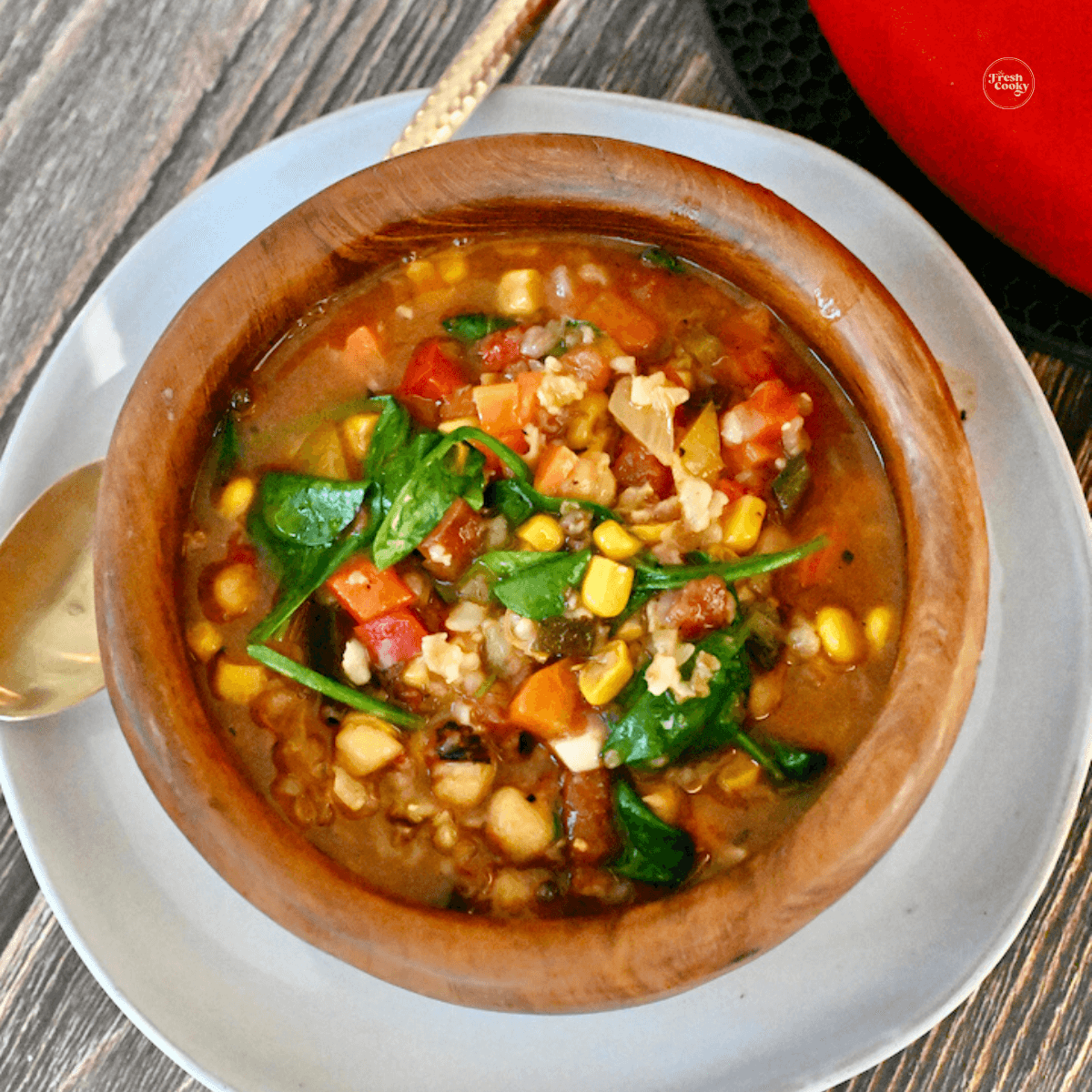 Panera Bread 10 Vegetable Soup recipe in wooden bowl.