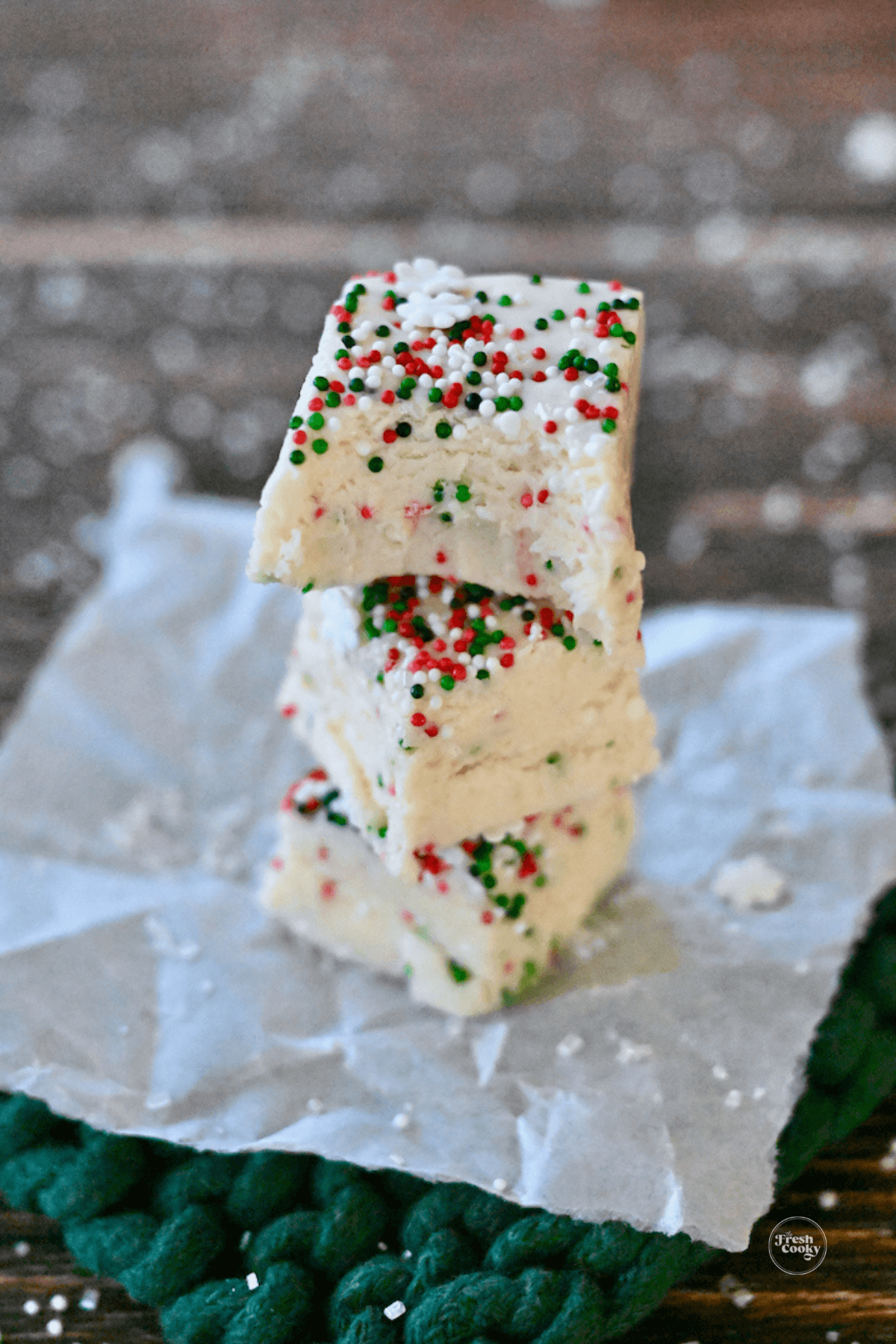 Stacked bites of Christmas cookie fudge.