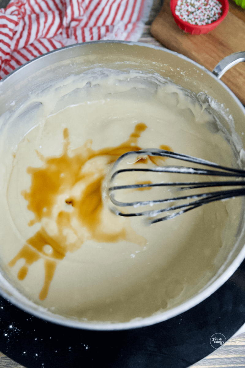 Stir in vanilla to sugar cookie fudge.