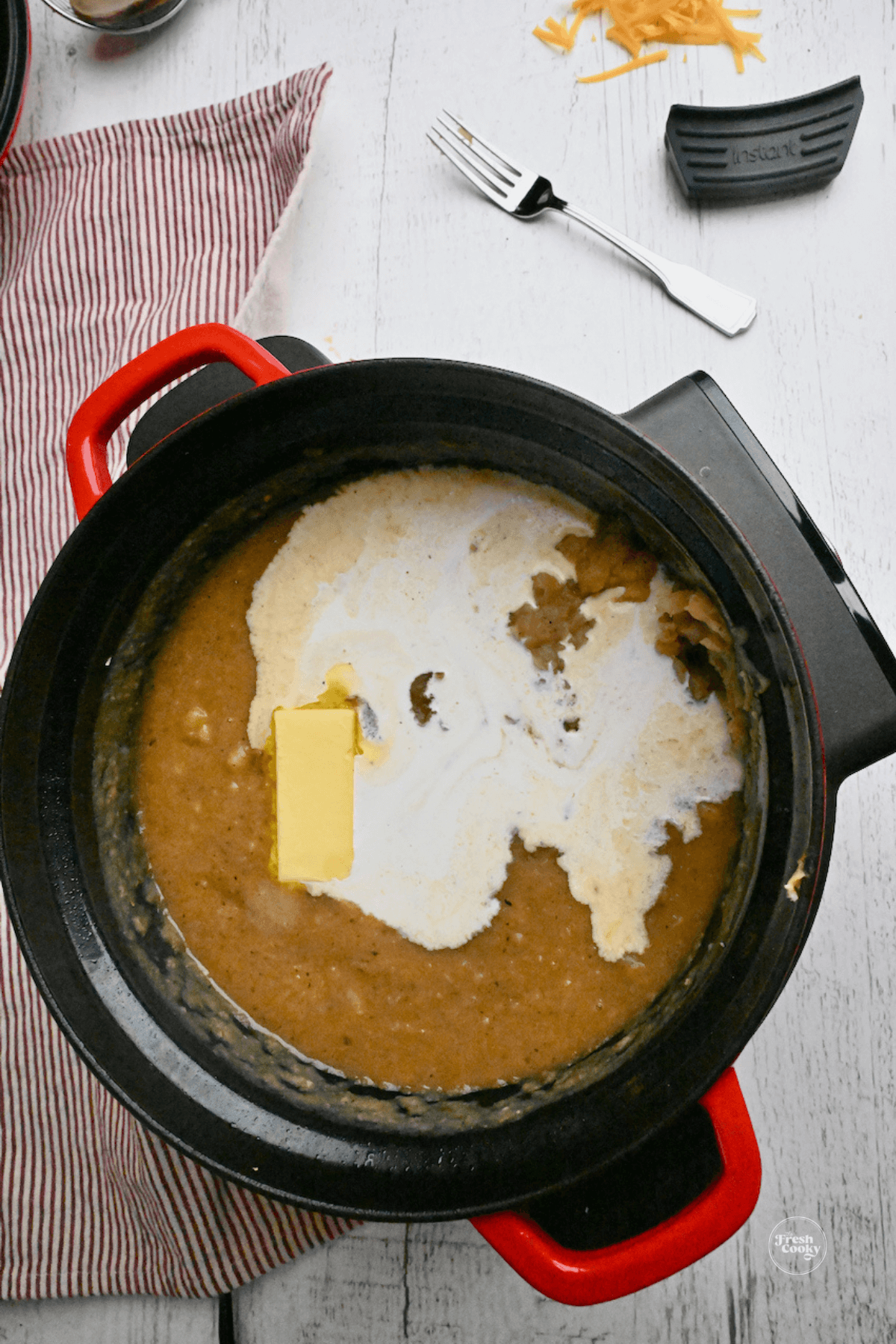 Butter and heavy cream poured into slow cooker. 