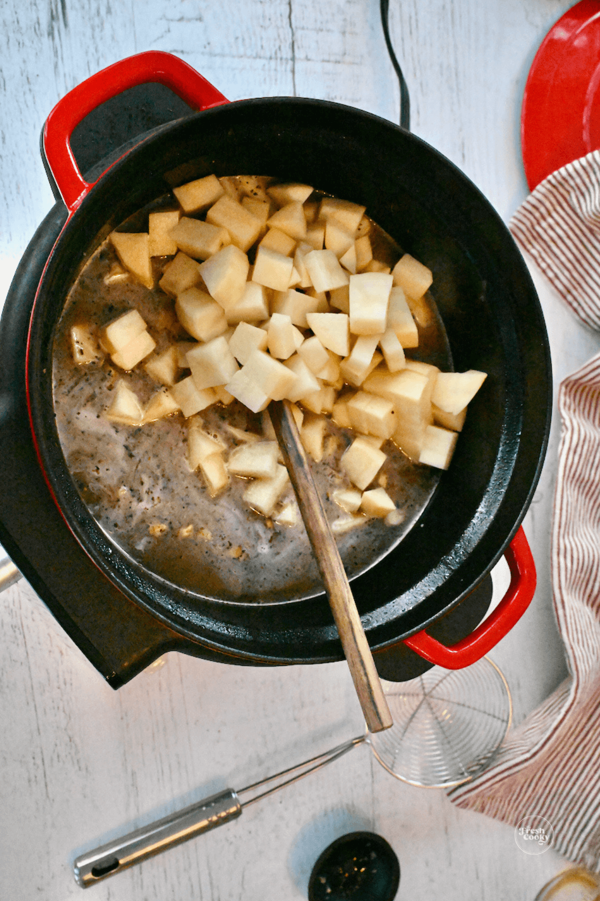 Diced potatoes in Dutch oven. 