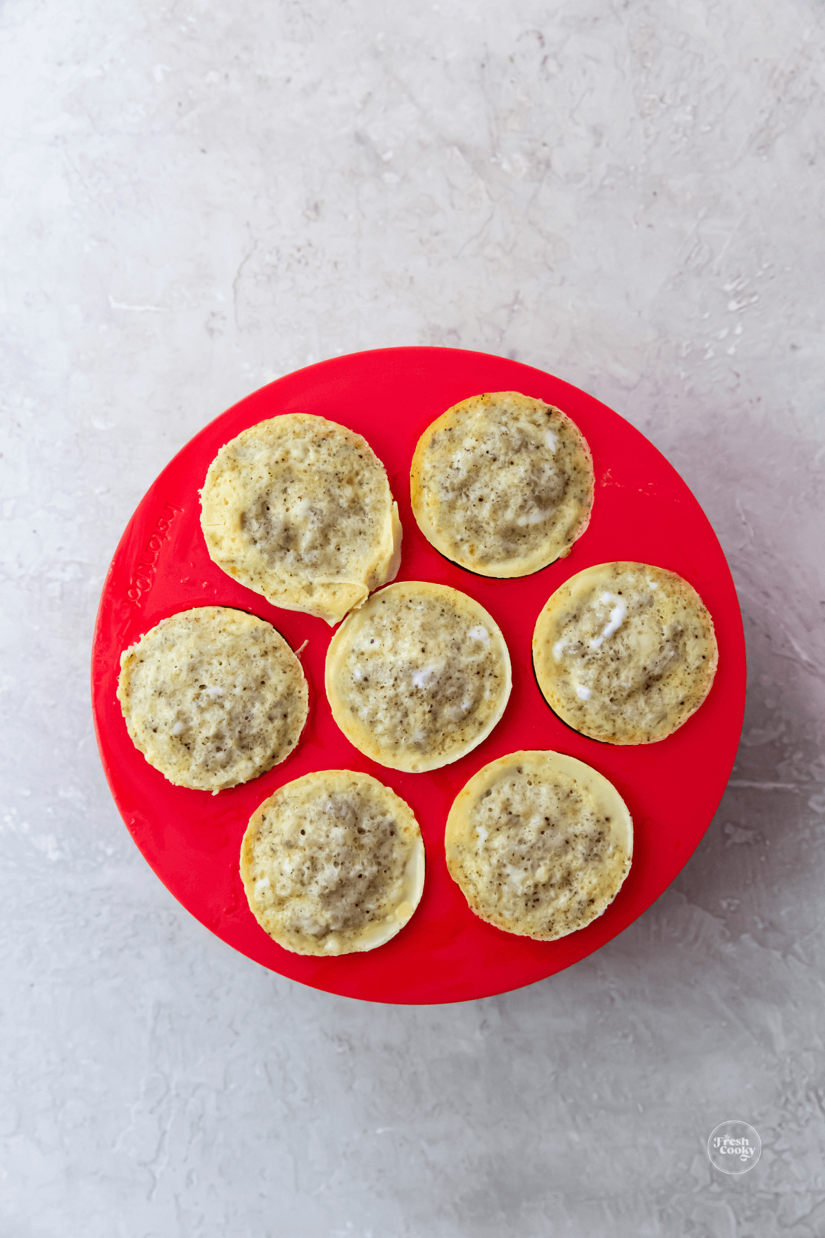 Egg bites in silicone mold on table.