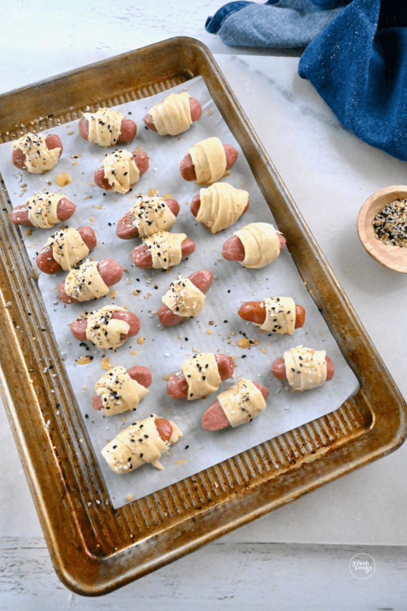 Wrapped pigs in a blanket ready for the oven.