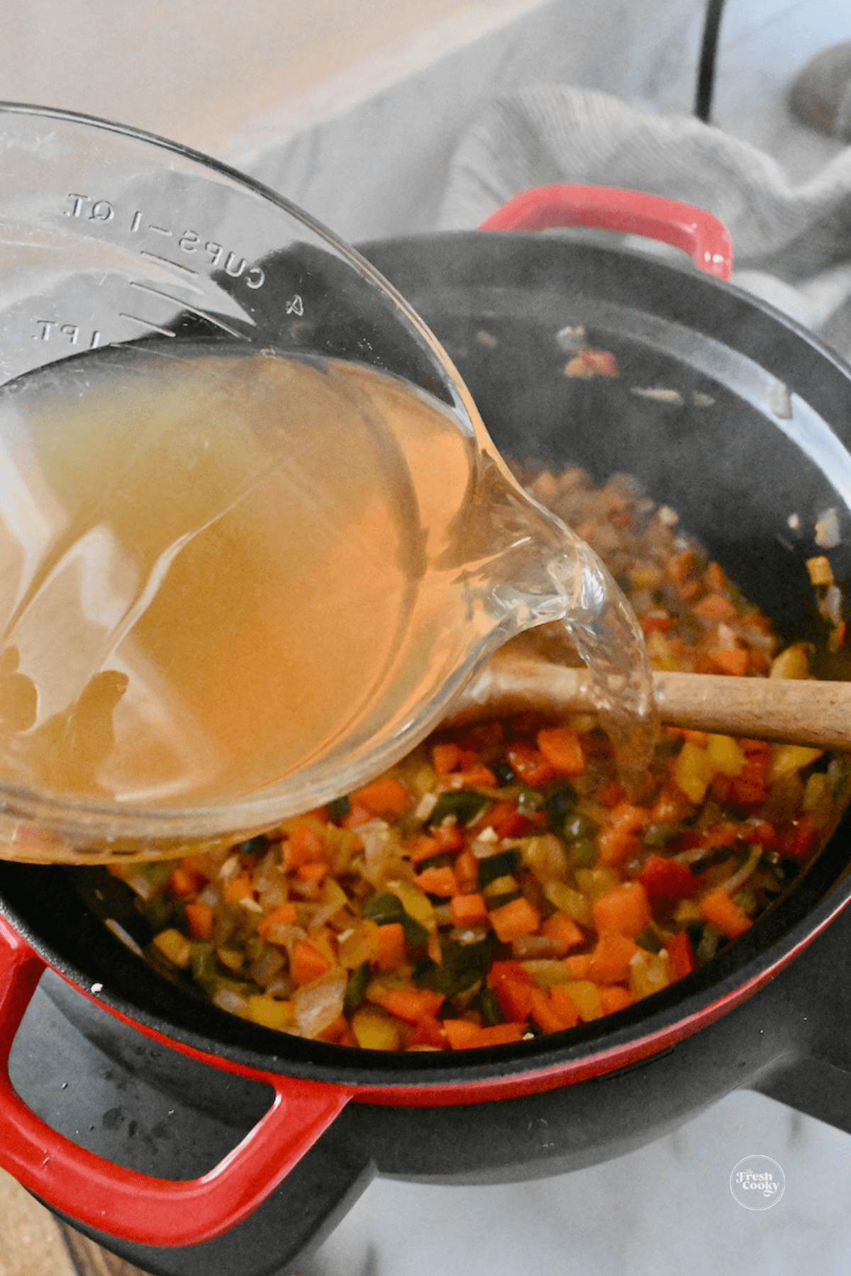 Add vegetable broth to deglaze the pan.