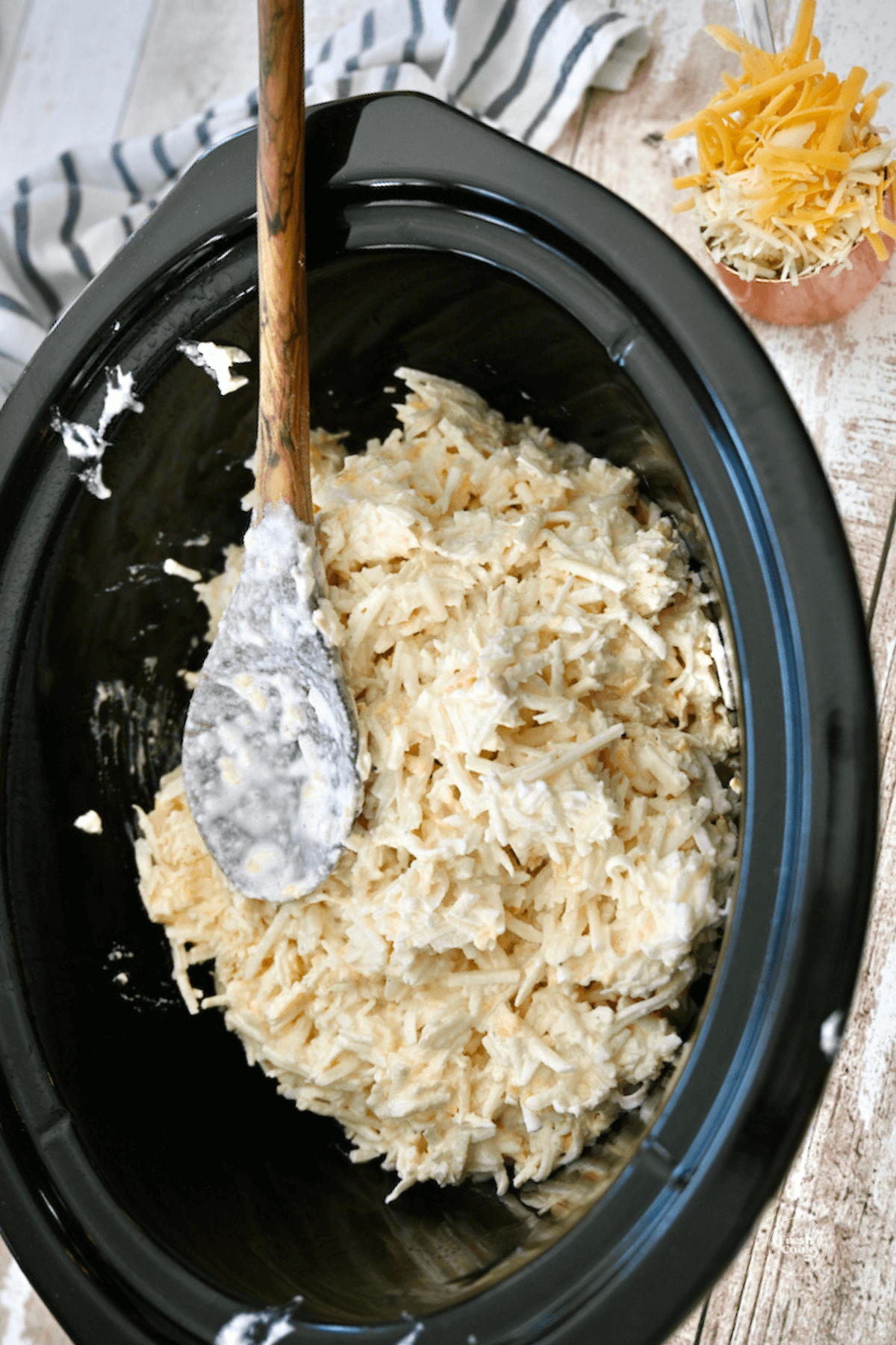 Spread hashbrown mixture into crockpot, evenly, cover and cook. 