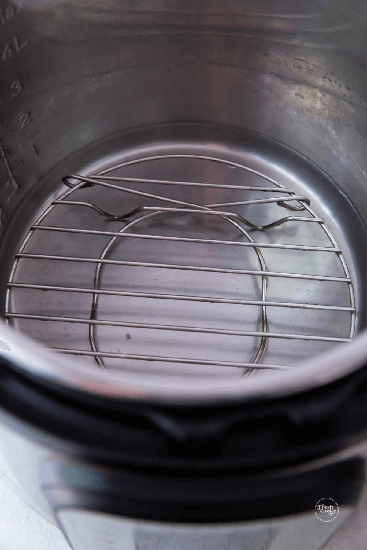 Place trivet in instant pot and a cup of water.