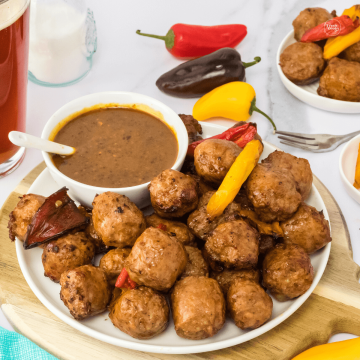 Air Fryer sausage with peppers with spicy brown mustard ale sauce.