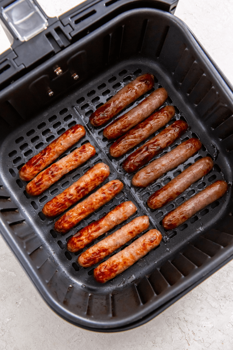 Link sausage in air fryer basket after cooking. 