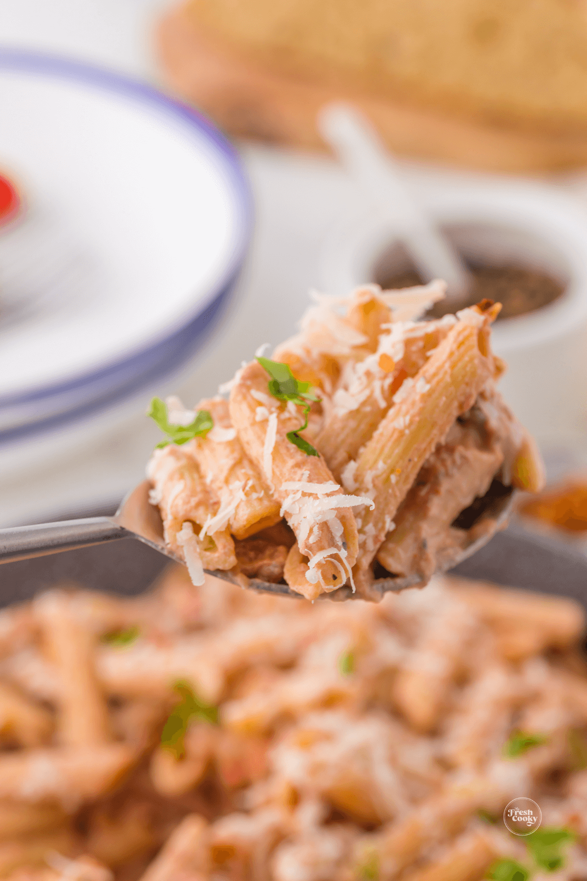 Spoonful of one pot creamy sausage pasta. 