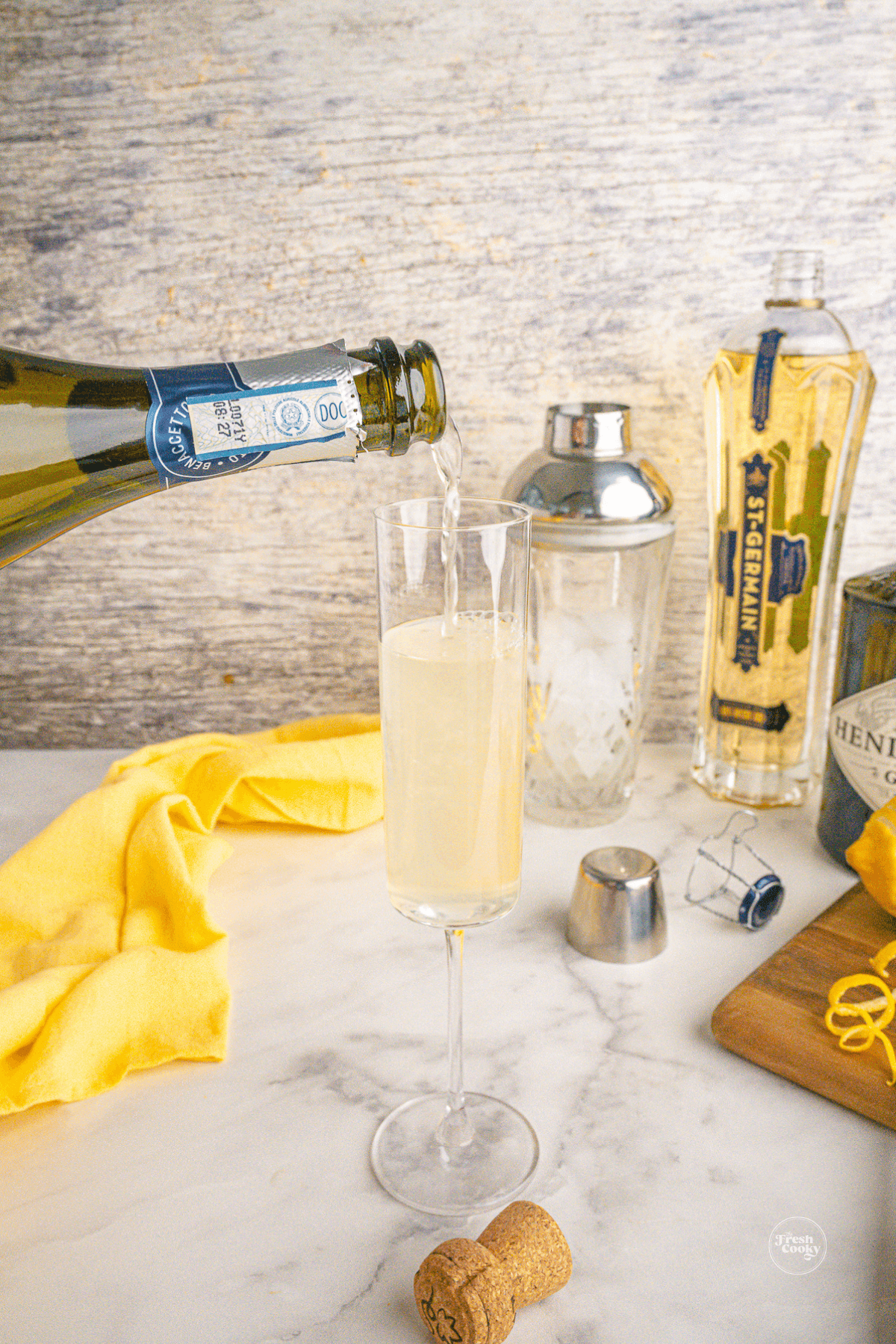 Top cocktail with champagne and a lemon twist.