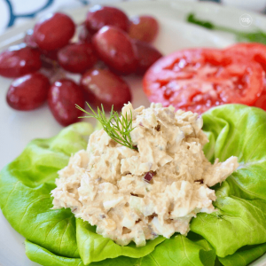 Classic Southern tuna salad on butter lettuce with grapes and tomato slices.