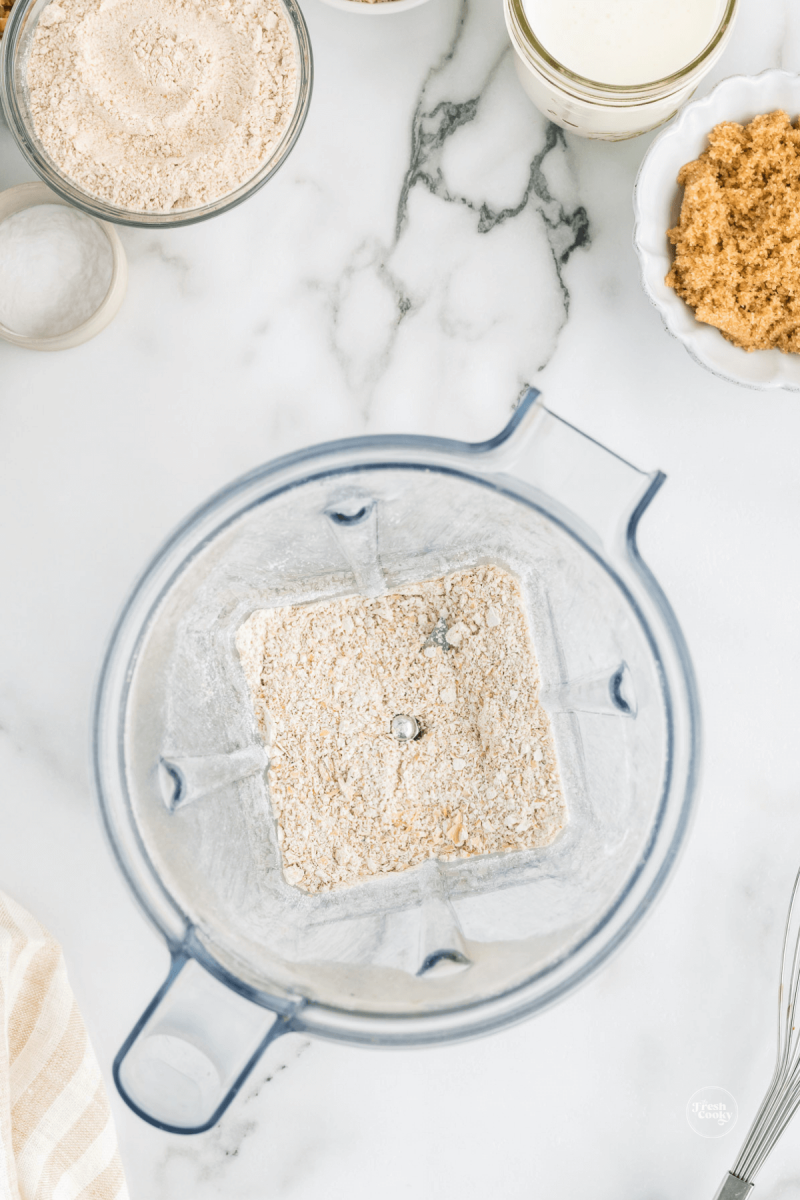 Rolled oats in blender, after blending into oat flour. 