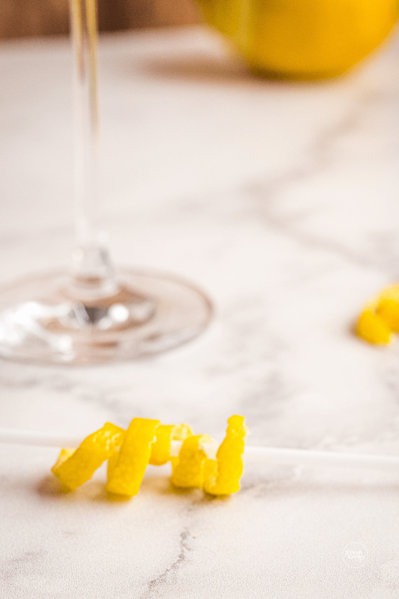 Lemon twist in a cocktail straw.