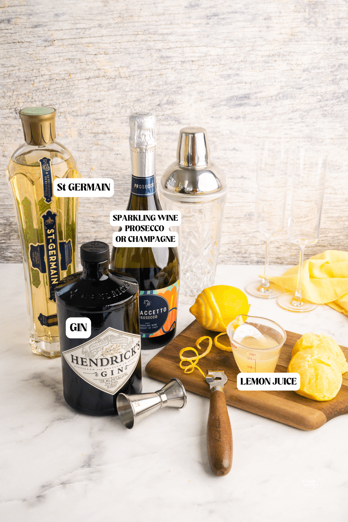 Labeled ingredients for French 75 recipe St Germain.