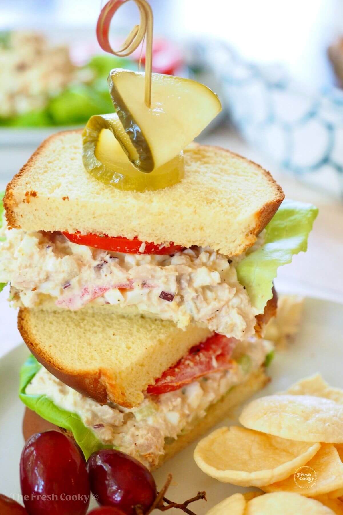 Southern tuna salad sandwich, stacked with tomato.